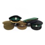 A collection of military hats,