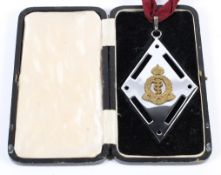 A Royal Army Medical Corp white metal cross-over buckle