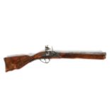 A reproduction decorative blunderbuss, with wooden stock and decorative metal barrel and mechanism,