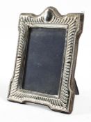 A contemporary hallmarked silver picture frame of rectangular form, with easel back,