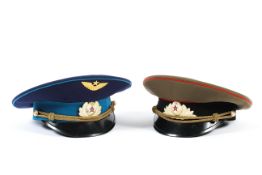 Two 20th century Russian officer's caps with makers labels to underside