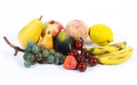 A collection of contemporary stone and painted resin fruit, including a bunch of grapes, cherries,