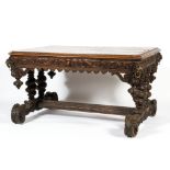 A Victorian carved oak dining table,