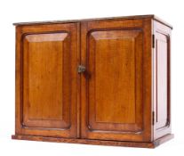 An Edwardian mahogany and oak small tabletop cabinet,