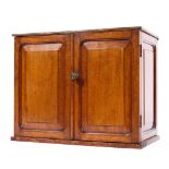 An Edwardian mahogany and oak small tabletop cabinet,