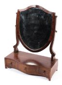 A Georgian mahogany dressing table mirror,the shield shaped mirror frame,