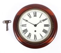 A mahogany cased LMS railway wall clock, with white painted dial and black Roman numerals,