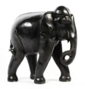 A large carved ebony model of an elephant,