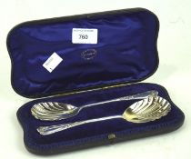 A pair of late Victorian silver spoons, each with shell shaped bowl,