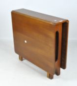 A mid 20th century drop leaf table,