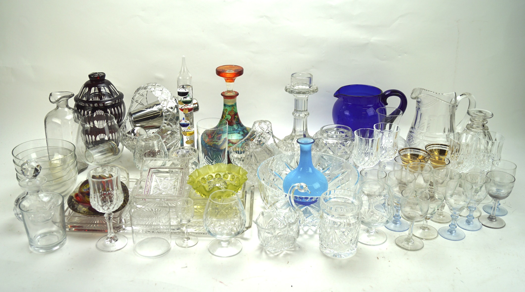 A large collection of assorted glassware, including jugs, paperweights, decanters, bowls and more,