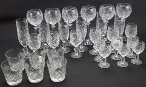 A large collection of glassware, including spirit glasses, beakers and wine glasses,