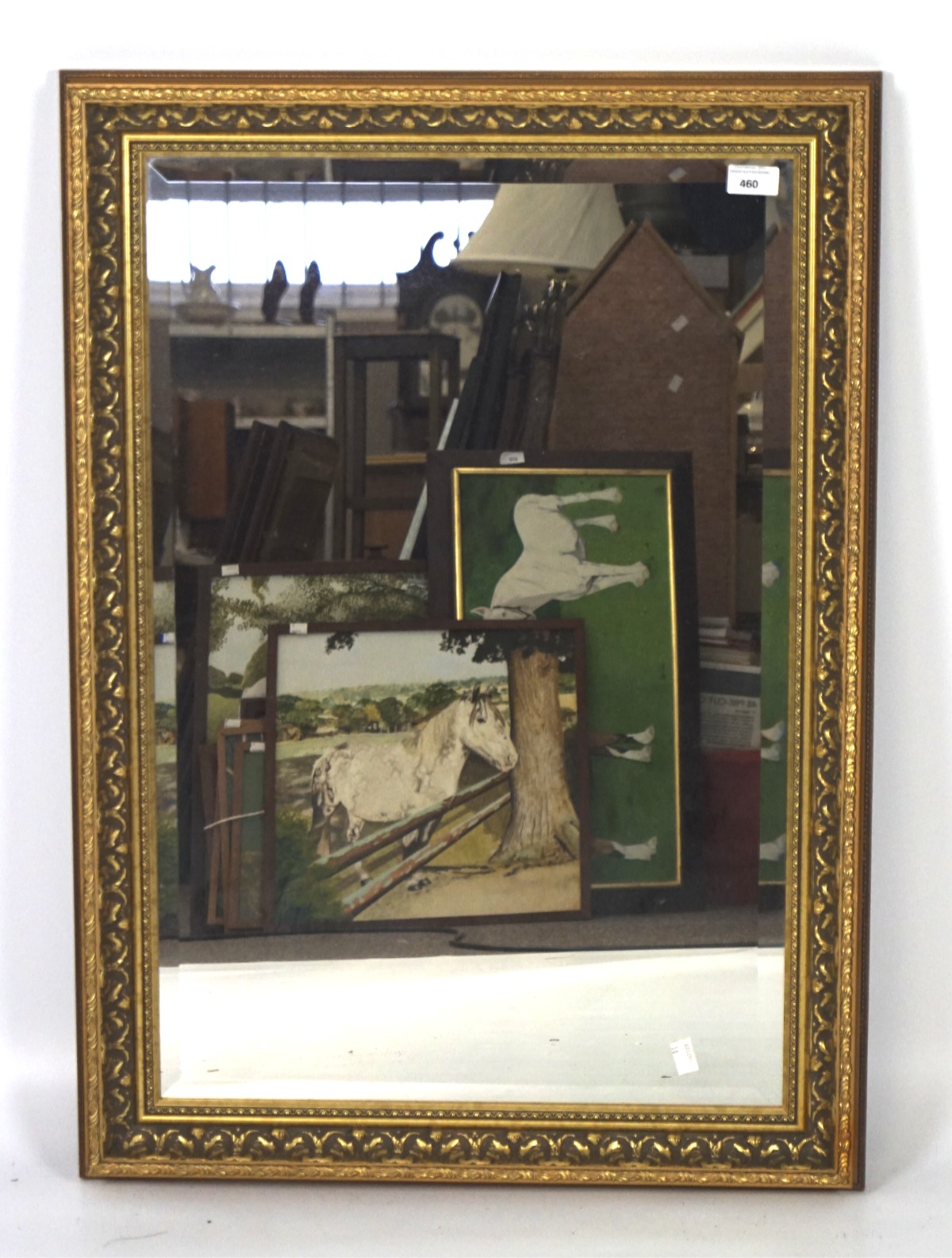 A gilt framed bevelled edge wall mirror, of rectangular form,