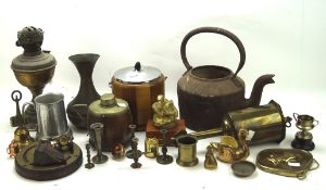 A collection of copper and brassware, including a kettle, miniature trophies, an oil lamp base,