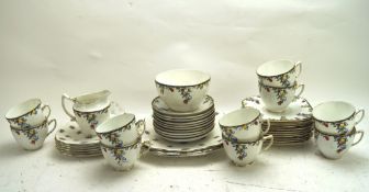 A part Wetley tea set and seven Royal Standard plates, the first decorated with colouful fruits,