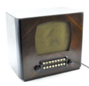 A vintage Bush Gaumont radio, in wooden veneered case, serial no E08938,