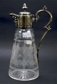 A 20th century metal topped glass claret jug, the tapering body with cut glass details,