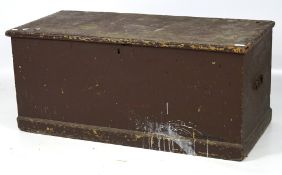 A large wooden blanket box, painted brown, with a hinged lid and a plinth base,