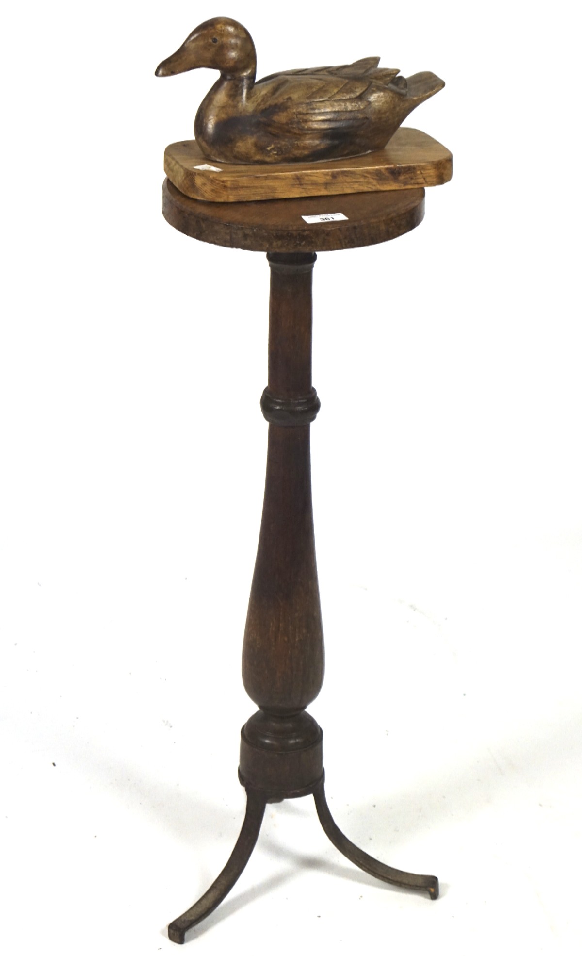 A 19th century turned oak jardiniere stand and a carved wooden model of a duck,