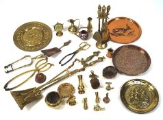 A collection of brass and copper ware, including miniature vases, chargers,