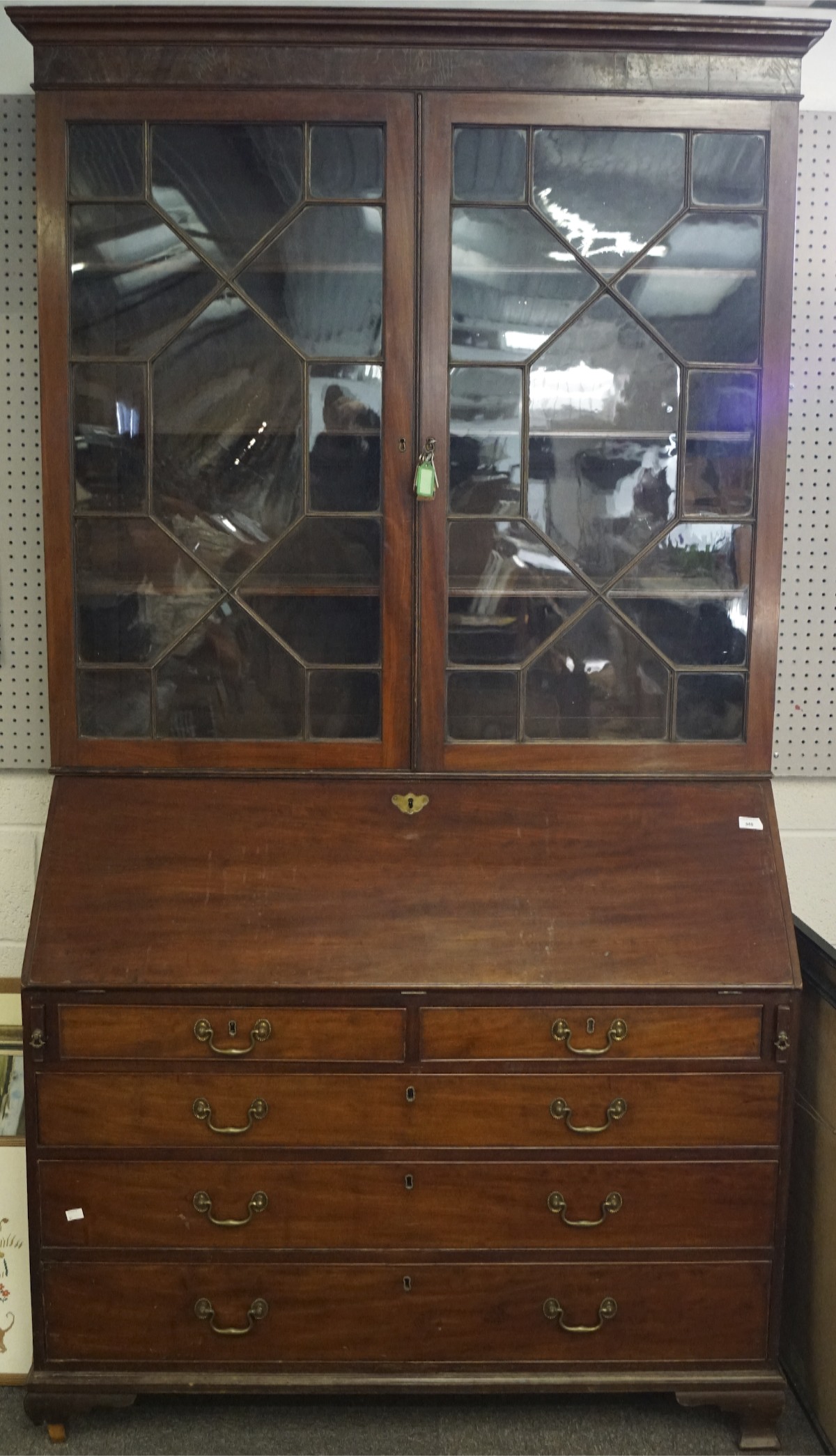 A Victorian mahogany bureau bookcase, the two door glazed bookcase with six adjustable shelves,