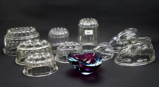 A collection of vintage glass jelly moulds, of assorted designs including modelled as rabbits,