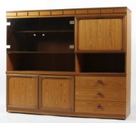 A 20th century veneered and glazed display and storage cabinet