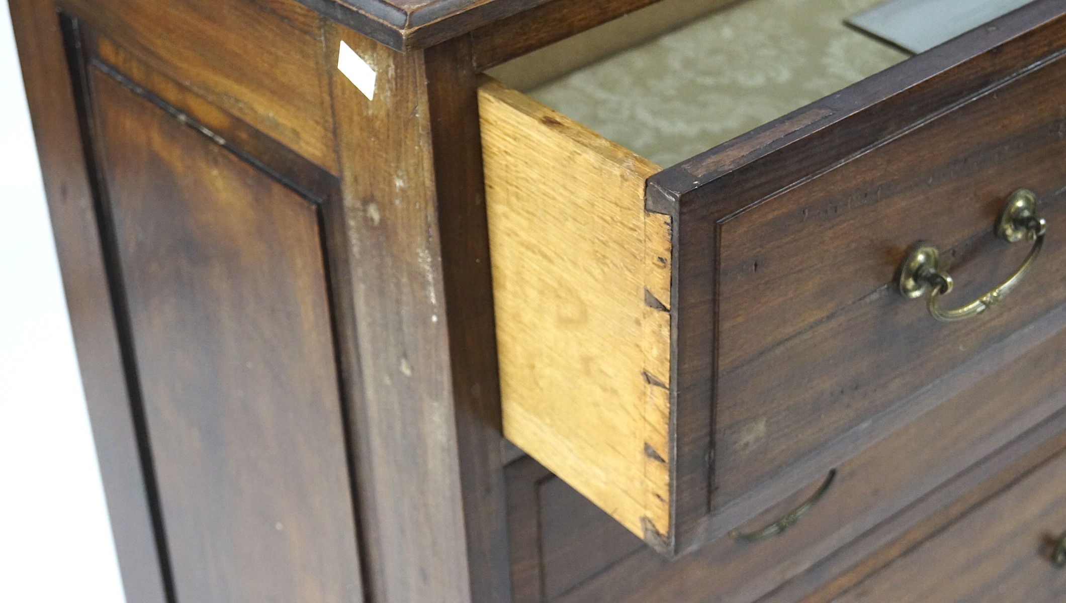 A 19th century mahogany chest of drawers, three shelves with metal handles, on raised supports, - Image 2 of 3