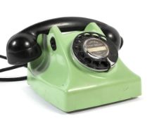 A retro GEC green telephone, with black dial and handset,