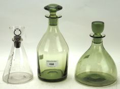 Three Whitefriars glass decanters, two in green with shaped stoppers,