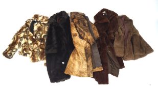 A collection of five vintage fur and faux fur coats, short and long, in chestnut brown,