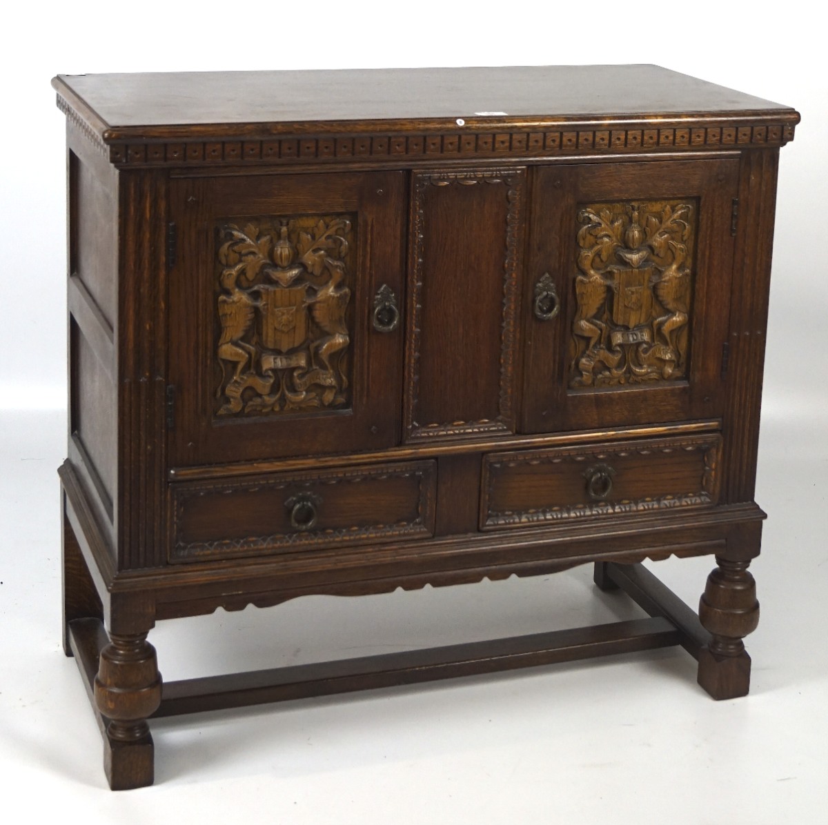 A mid 20th century oak cabinet, in the 19th century style,