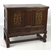 A mid 20th century oak cabinet, in the 19th century style,