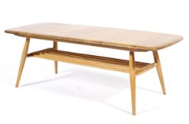 An Ercol style blonde beech and elm coffee table of rounded rectangular form,