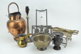 A quantity of brass and metal ware, including: trivets, tongs,