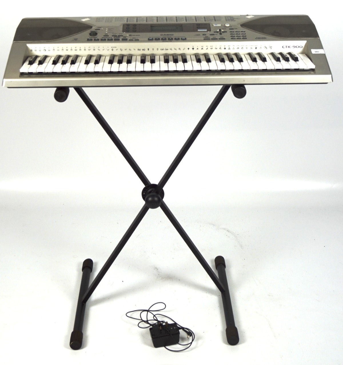 A Casio CTK-900 keyboard with matching stand,