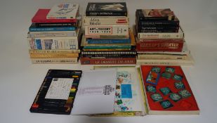 A collection of 20th century and later books, regarding painting, sports and the French language,
