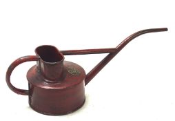 A vintage Haws watering can, red painted, with attached metal name plaque to front,