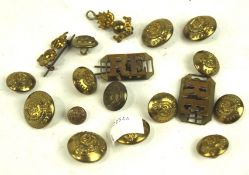 A collection of assorted military buttons and cap badges,