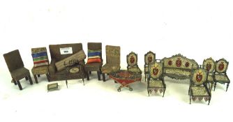 Two sets of dolls house furniture, the first including a table, sofa and chairs,