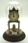 A 20th century anniversary clock, with disc pendulum, the dial with Arabic numerals denoting hours,