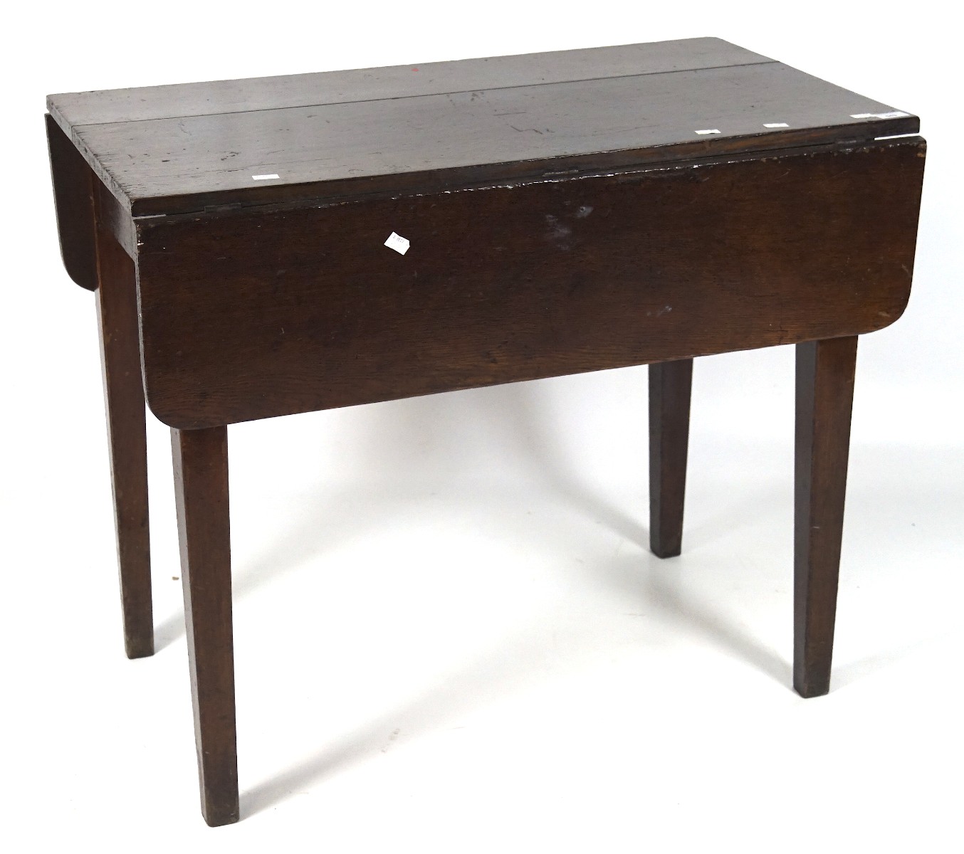 A 20th century oak drop flap Pembroke table, with large fitted drawer through the middle,