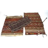 A group of three 20th century woven kilim-pattern grain sacks, all with ties,