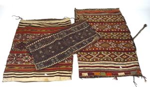 A group of three 20th century woven kilim-pattern grain sacks, all with ties,