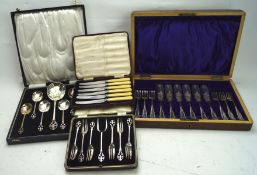 Four boxed sets of silver plated flatware, including a set of six butter knives,