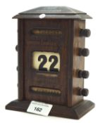 Early 20th century oak cased desk top calendar,