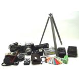 An assortment of vintage cameras and related equipment, to include a Kodak Brownie 127,