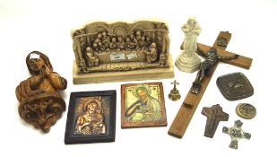 An assortment of religious themed collectables, including plaques, wooden sculptures,