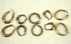 A collection of various 9ct gold and yellow metal earrings, most of hoop form,