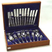 A late 20th century silver-plated cutlery canteen, the six piece set within a fitted blue interior,